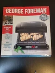New George Foreman 4-SERVING Removable Plate Electric Grill And Panini Press. Fixed Price $36.00.