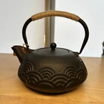 World Market Cast Iron Teapot Kettle Japanese Wave Pattern Fiber Wrapped Handle. Fixed Price $20.00.
