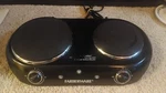 Farberware HP202-D11 Royalty 1800 Double Burner Black Electric Cooktop. Fixed Price $26.24.