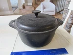 Vintage Heuck Classic Cast Iron Pot And Lid. Fixed Price $69.99.