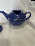 Aramco Imports Purple Tea Pot With Smiling Face And Three Nose. Fixed Price $10.00.